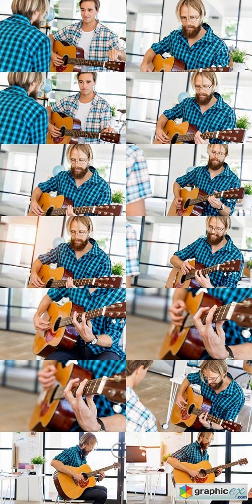 Man playing guitar in office