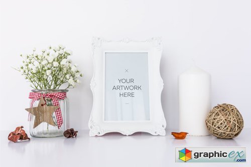 White Frame Mockup With Candle & Flowers