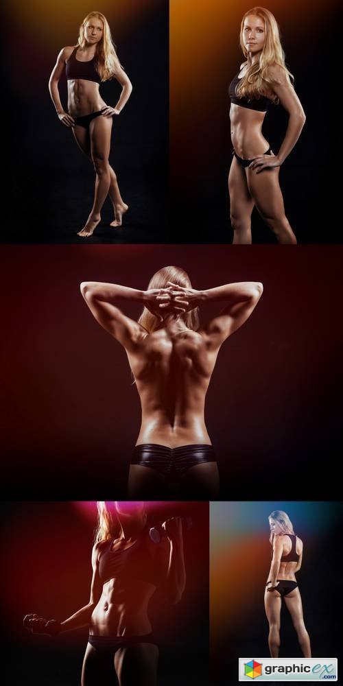 Muscular Fitness Woman Posing on a Dark Background