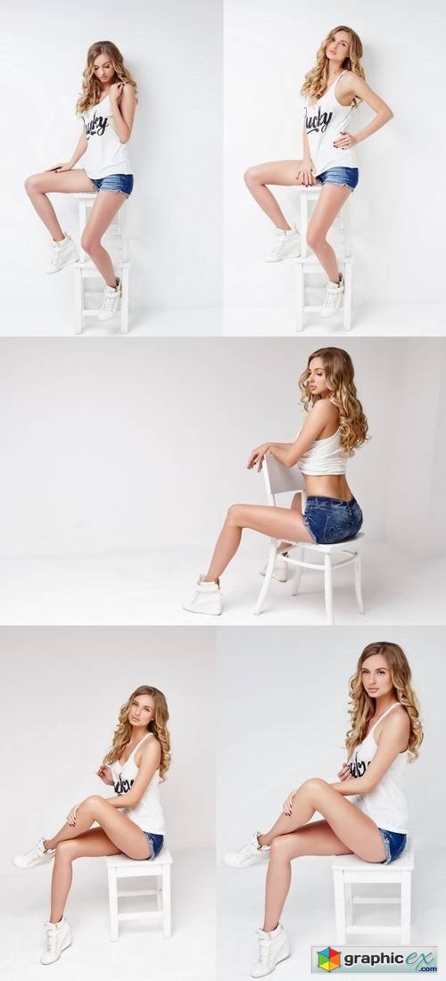 Sexy Blond Female in a White T Shirt and Denim Shorts Posing on a Chair in a Studio