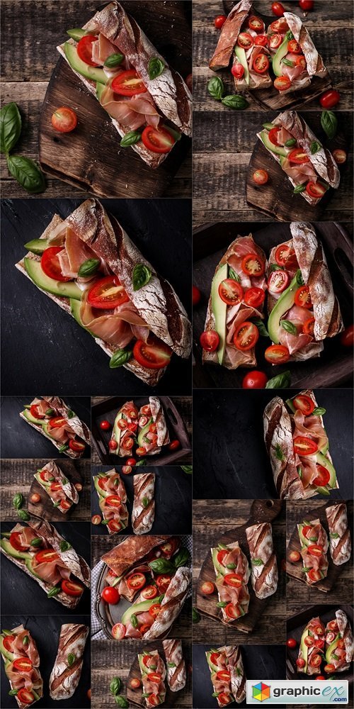 Ciabatta sandwich with prosciutto,avocado,cherry tomatoes and basil on dark background