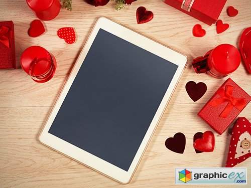 Tablet Surrounded by Valentine's Day Elements